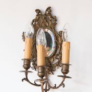 Pair of old French wall lights with beveled mirror and putti