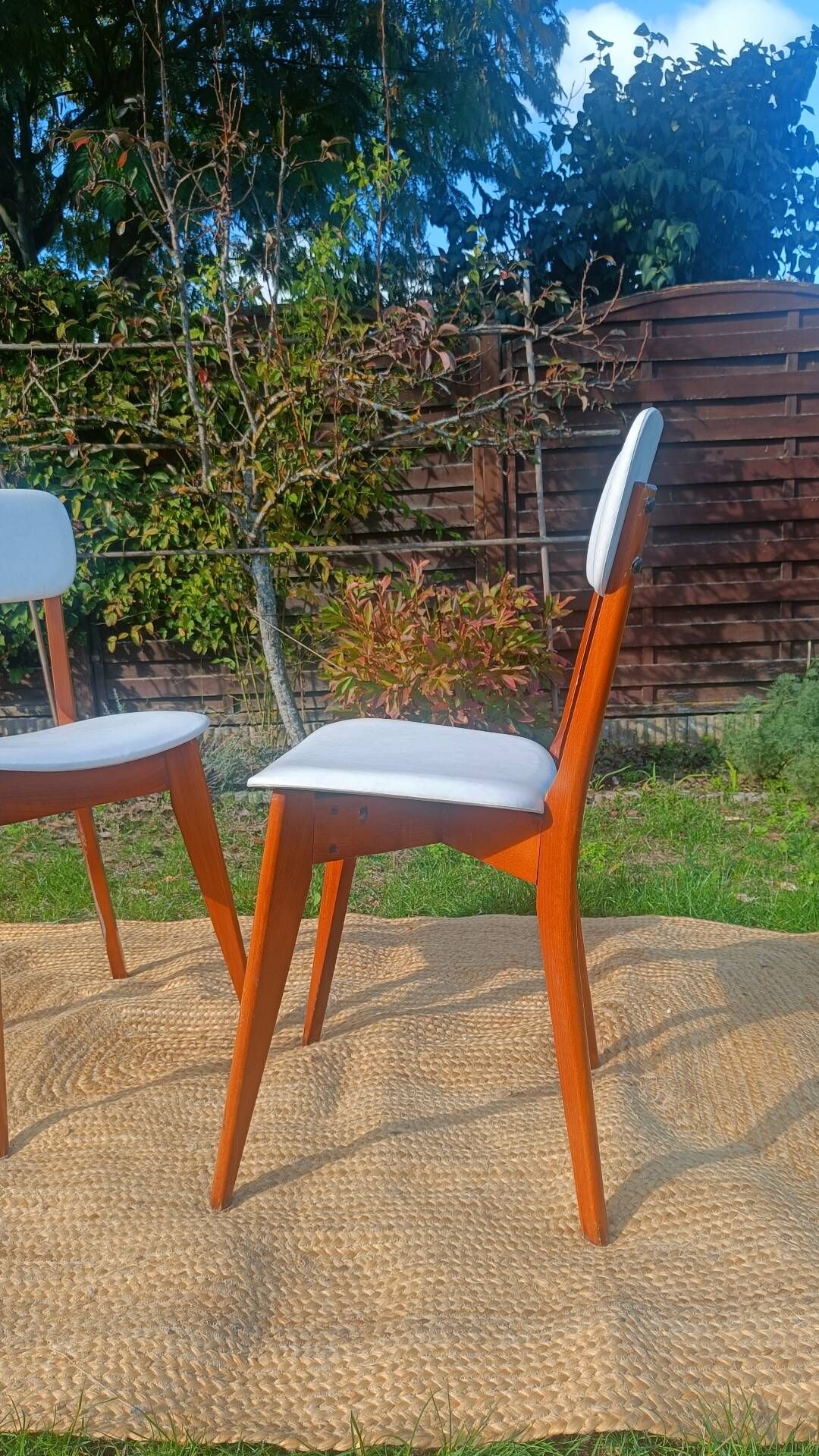 vintage wooden chairs with white faux leather