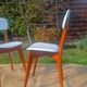 vintage wooden chairs with white faux leather