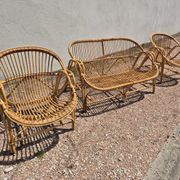 Rattan lounge with two armchairs and a vintage 1950s bench.