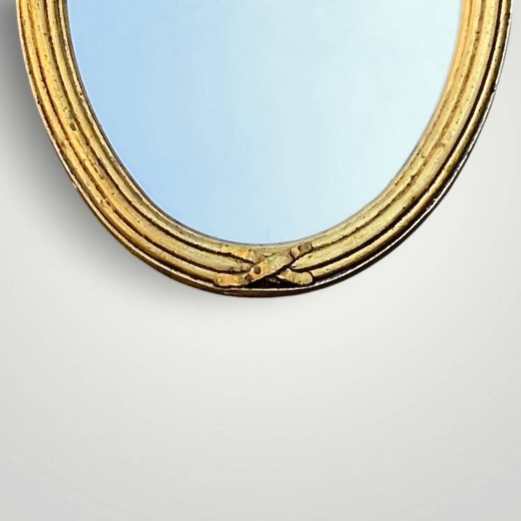 Antique oval wall mirror in gilded resin – Louis XVI knot –