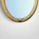 Antique oval wall mirror in gilded resin – Louis XVI knot –