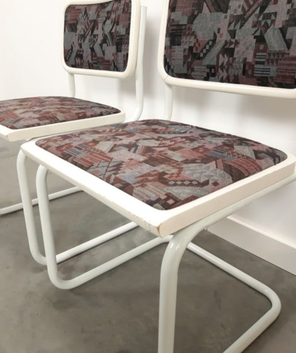 Pair of vintage tubular frame dining chairs