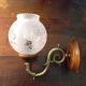 Wall lamps in wood and gilded metal, openwork glass lampshade