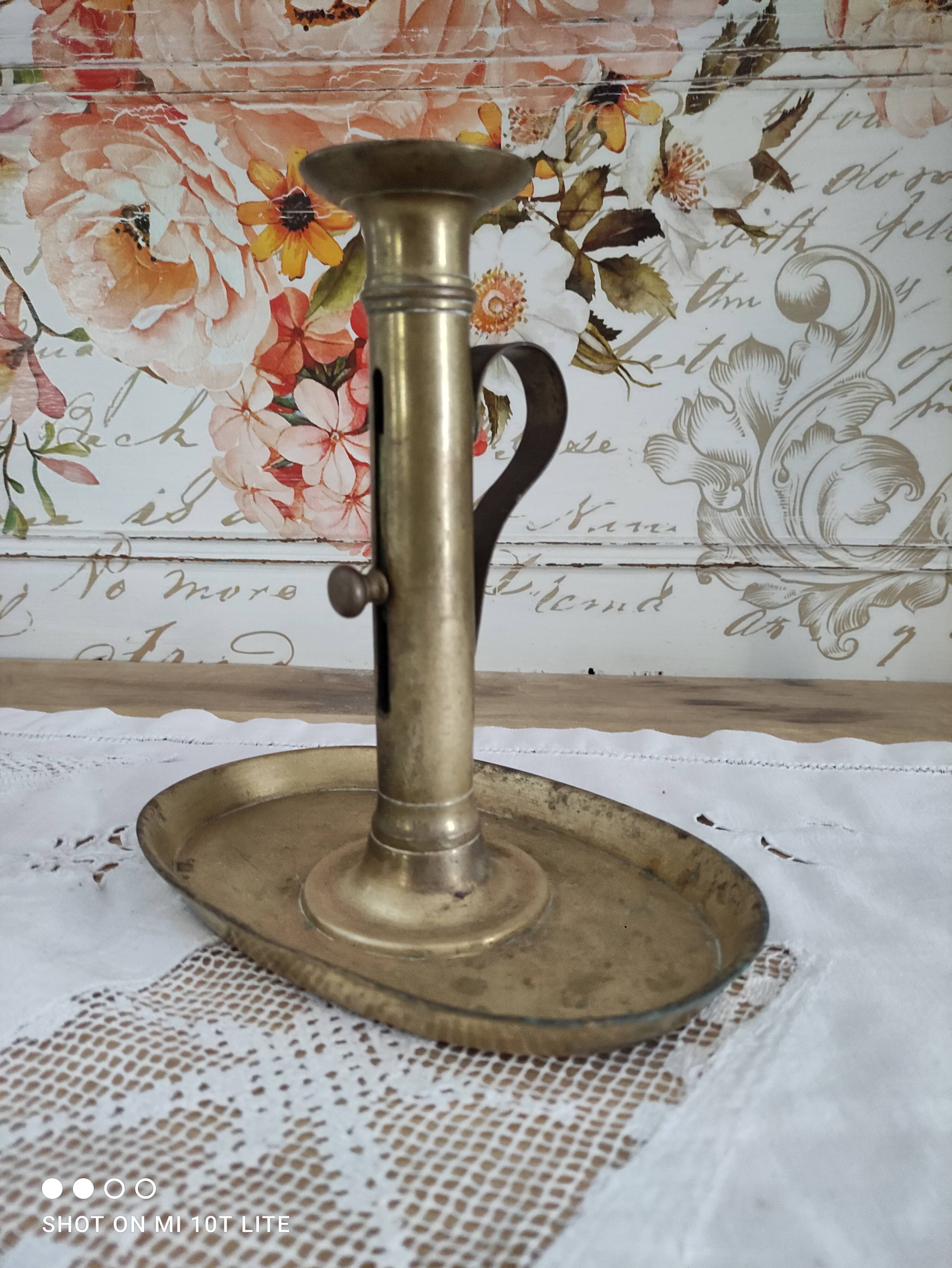 Brass pusher candle holder on oval frame