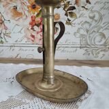 Brass pusher candle holder on oval frame