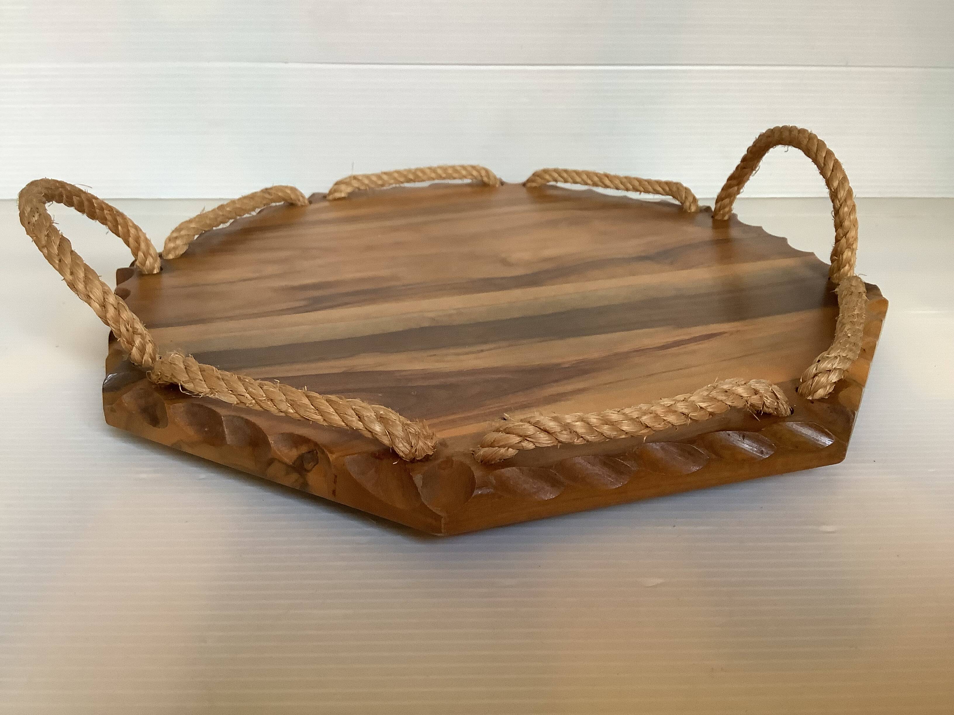 Small octagonal tray made of wood and rope.