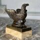 Eagle and serpent, bronze inkwell on a marble base.