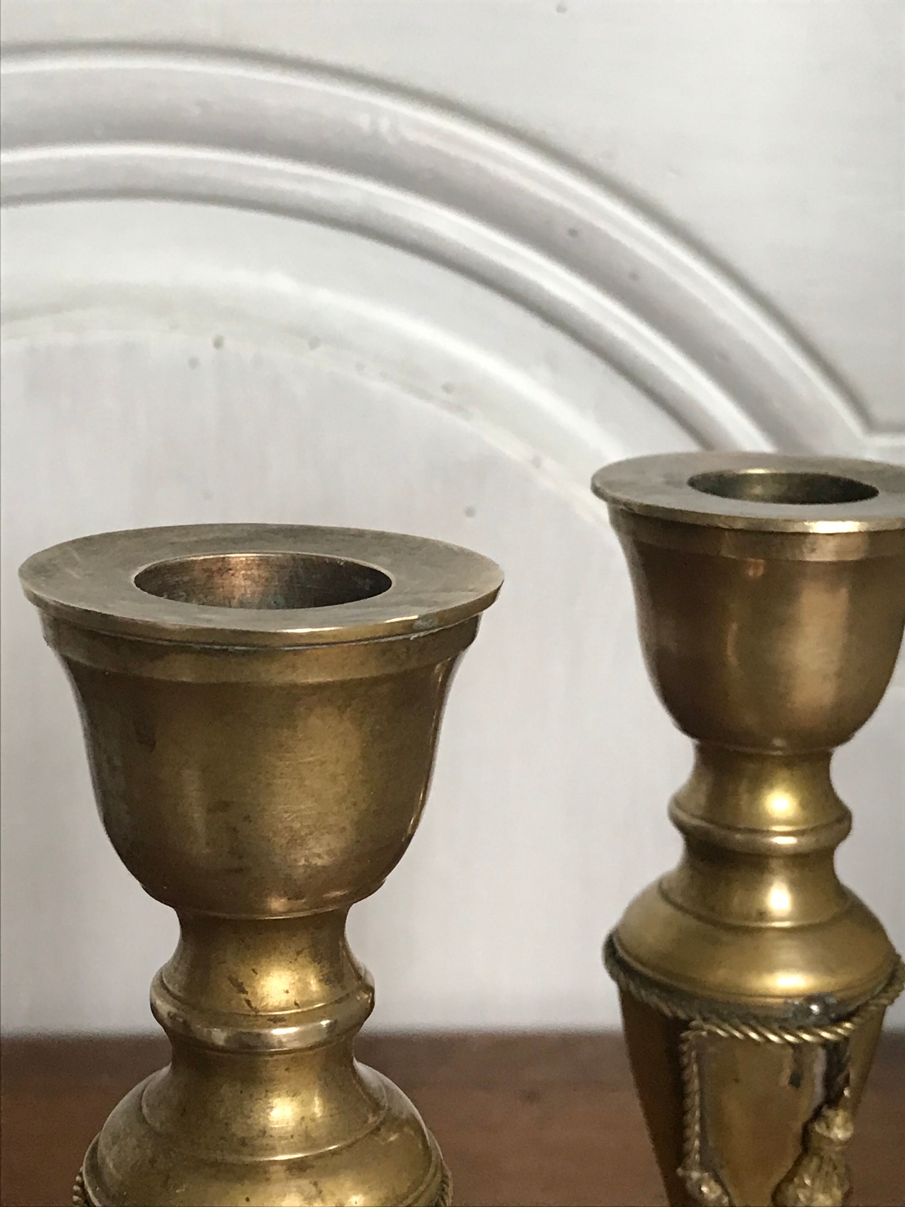 Pair of brass candlesticks with tassels