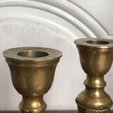 Pair of brass candlesticks with tassels