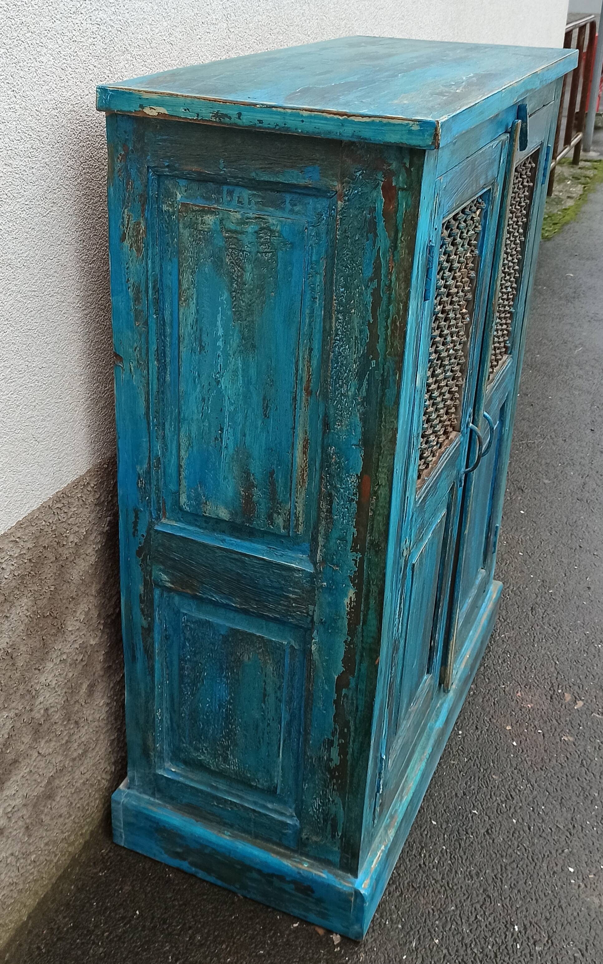 Old wooden cabinet with doors with grille