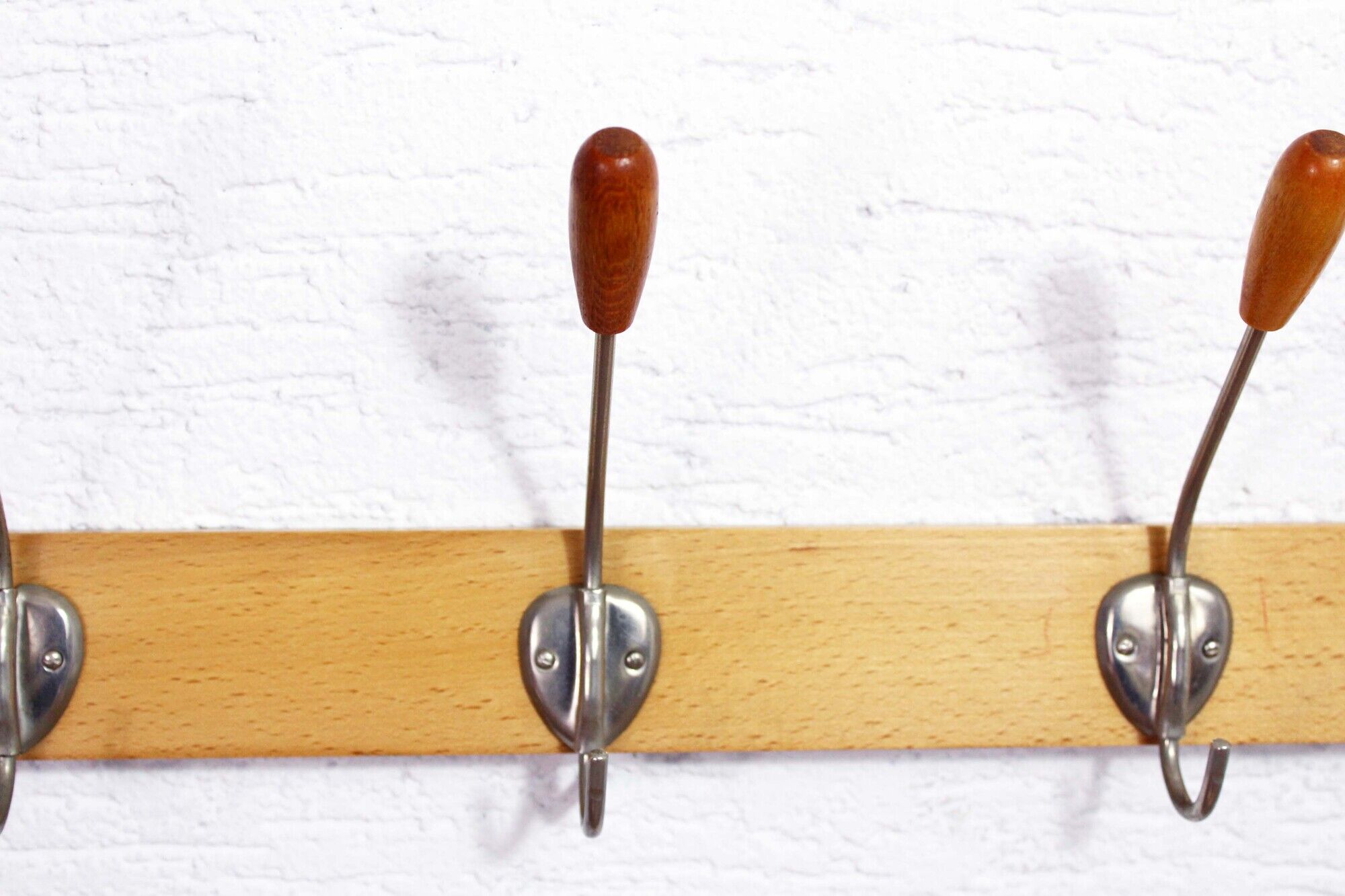 Peg wood and metal, wearing vintage coat