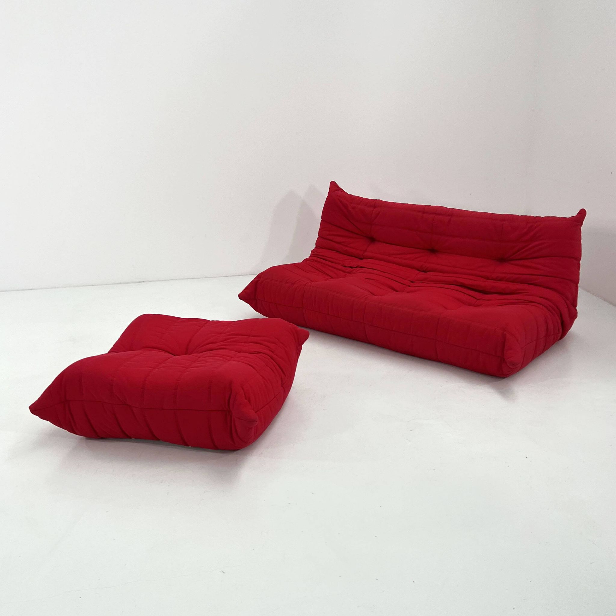 Togo 3-seater with red ottoman by Michel Ducaroy for Ligne Roset, 1970.