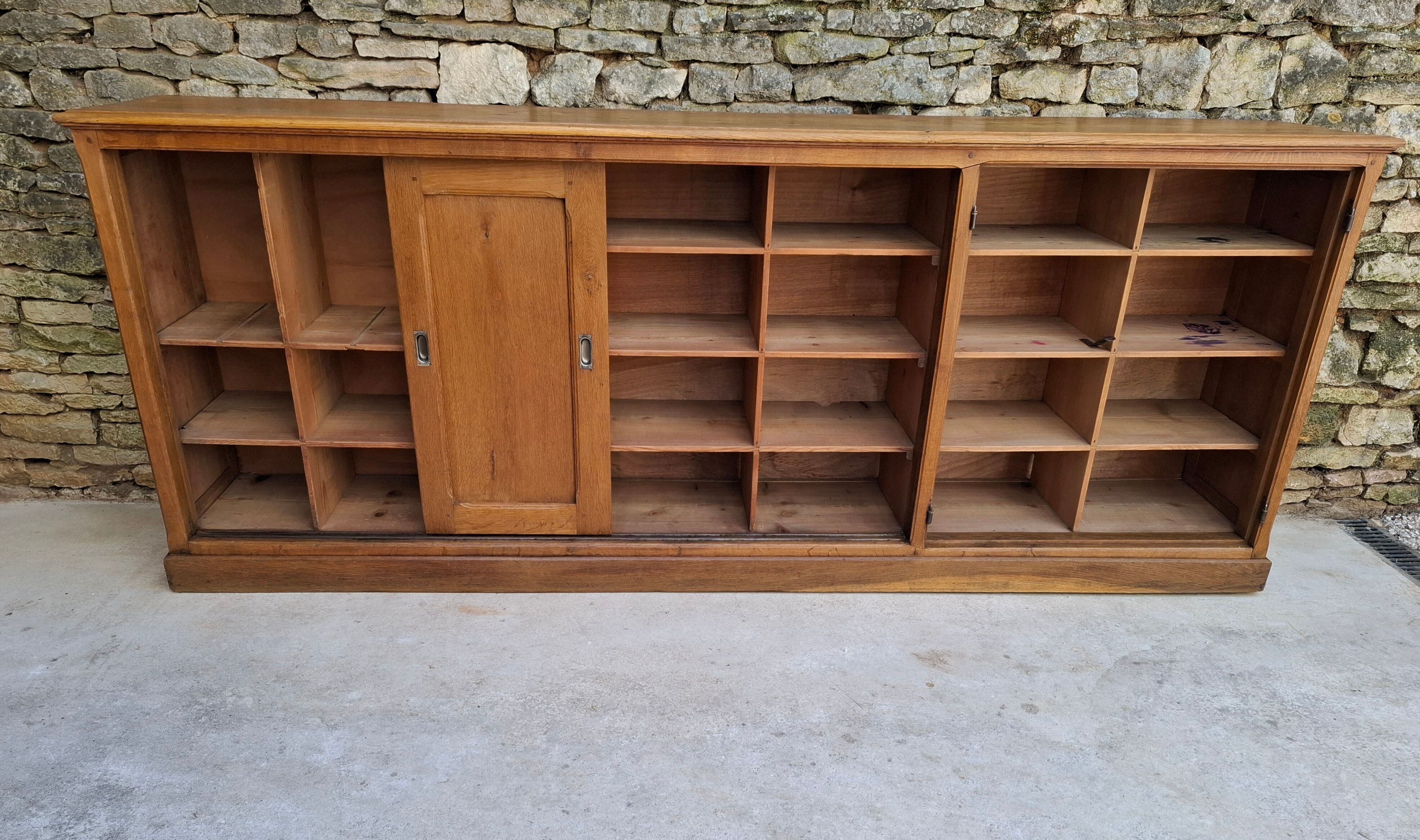 Oak workshop furniture with sliding doors.