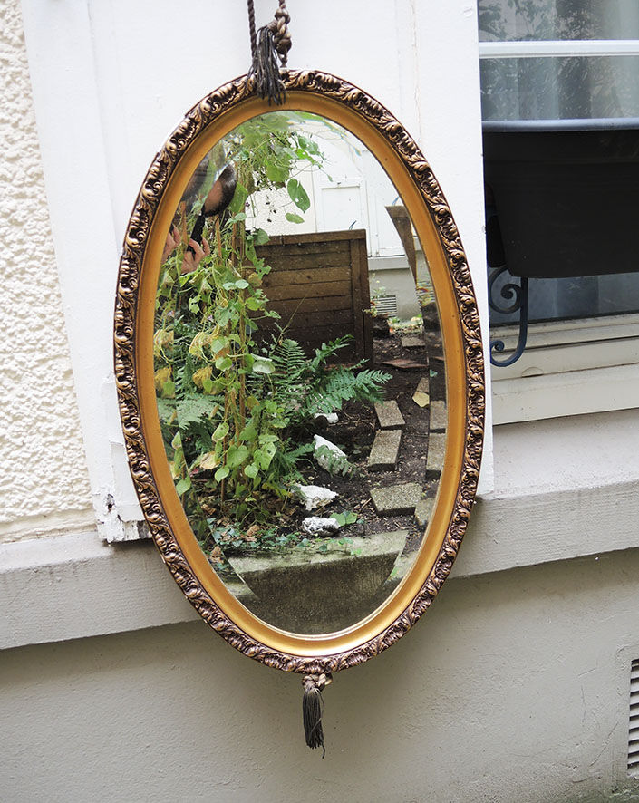 Beveled oval mirror