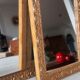 Paire de miroirs anciens en bois et en plâtre doré