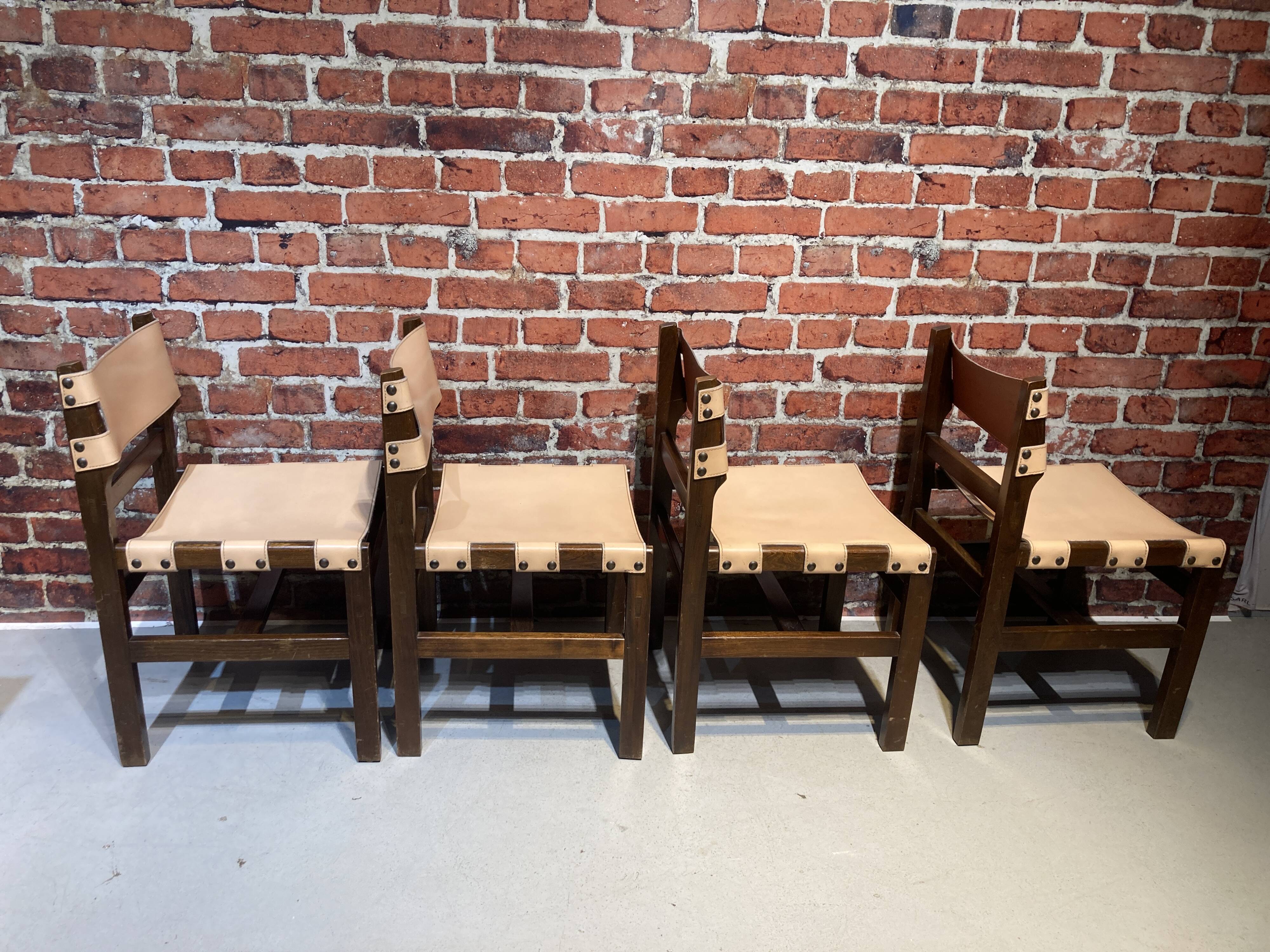 Set of four wooden and leather chairs from Maison Regain