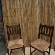 Pair of antique straw-seated farm chairs
