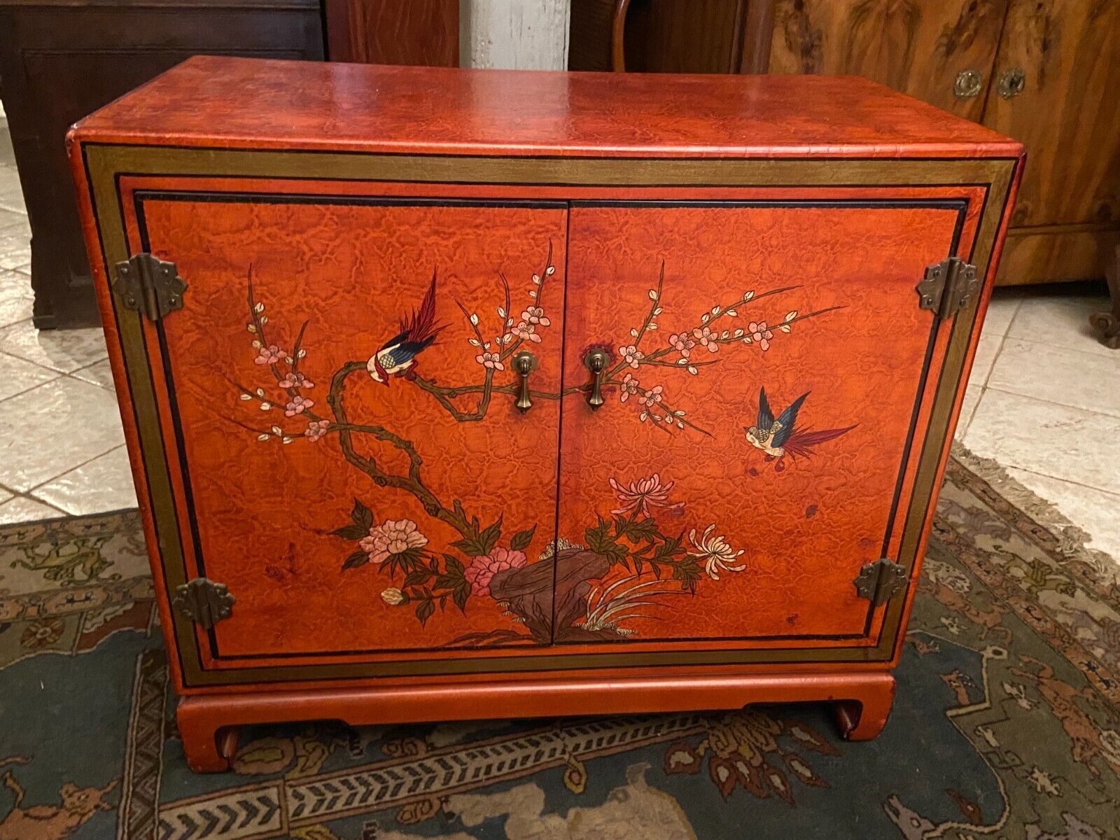 Low sideboard with lacquered decoration with birds on orange background Far East China Japan