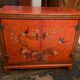 Low sideboard with lacquered decoration with birds on orange background Far East China Japan