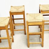 set of seven rattan and wood barstools
