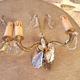 Gold wall light with tassel