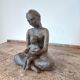 Terracotta statue of a woman with child, signed