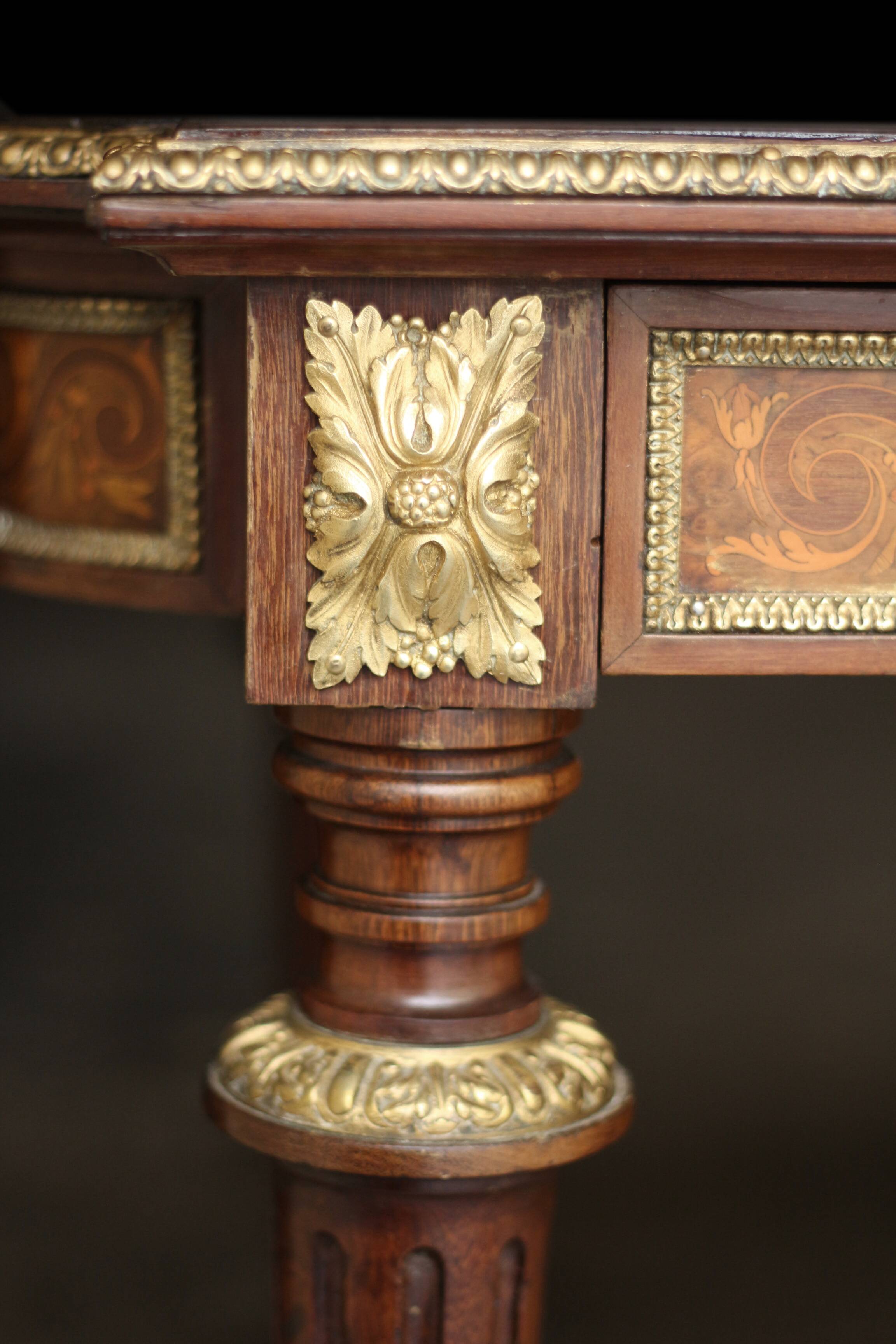 Superb Napoleon III table. Marquetry top and gilded bronzes.