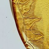 Glass plate decorated with suns, 1980.
