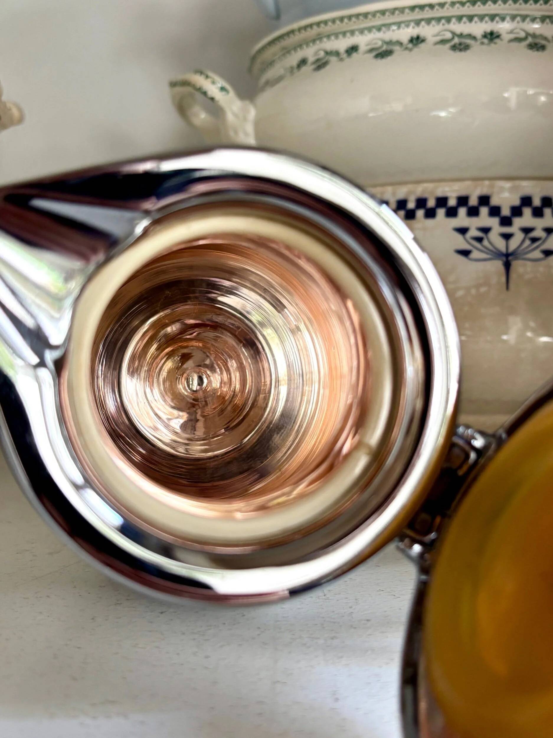 2 Hermès insulated jugs in chrome metal and covered leather.