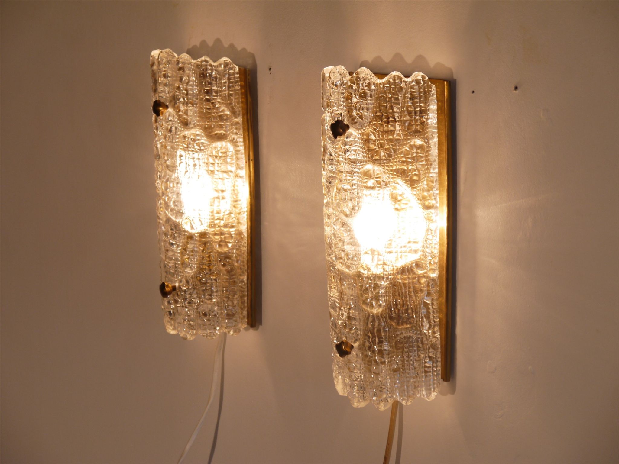 Pair of brass and crystal appliques by Carl Fagerlund for Orrefors