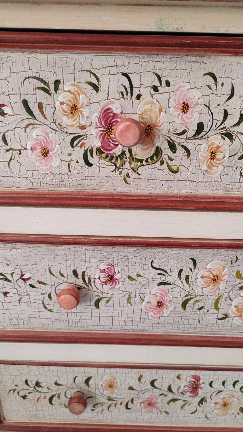 Painted chest of drawers with floral decoration