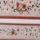 Painted chest of drawers with floral decoration