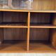 Teak bookshelf, sliding display + open storage, 60s/70s