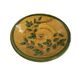Decorative glazed terracotta plate with olive leaf pattern.