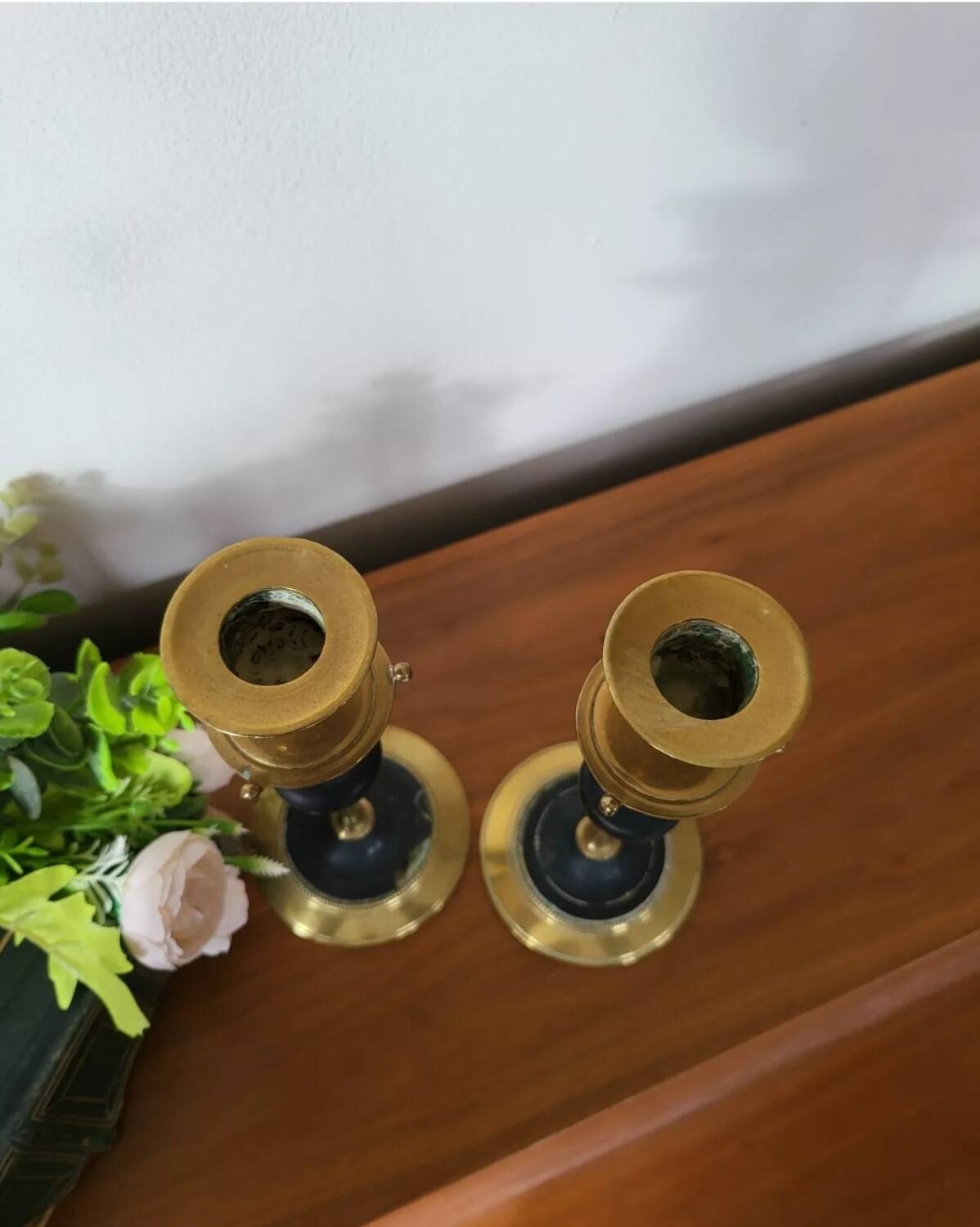 Pair of brass and black hard stone candlesticks