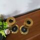 Pair of brass and black hard stone candlesticks
