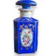 Perfume bottle in porcelain of old paris blue background