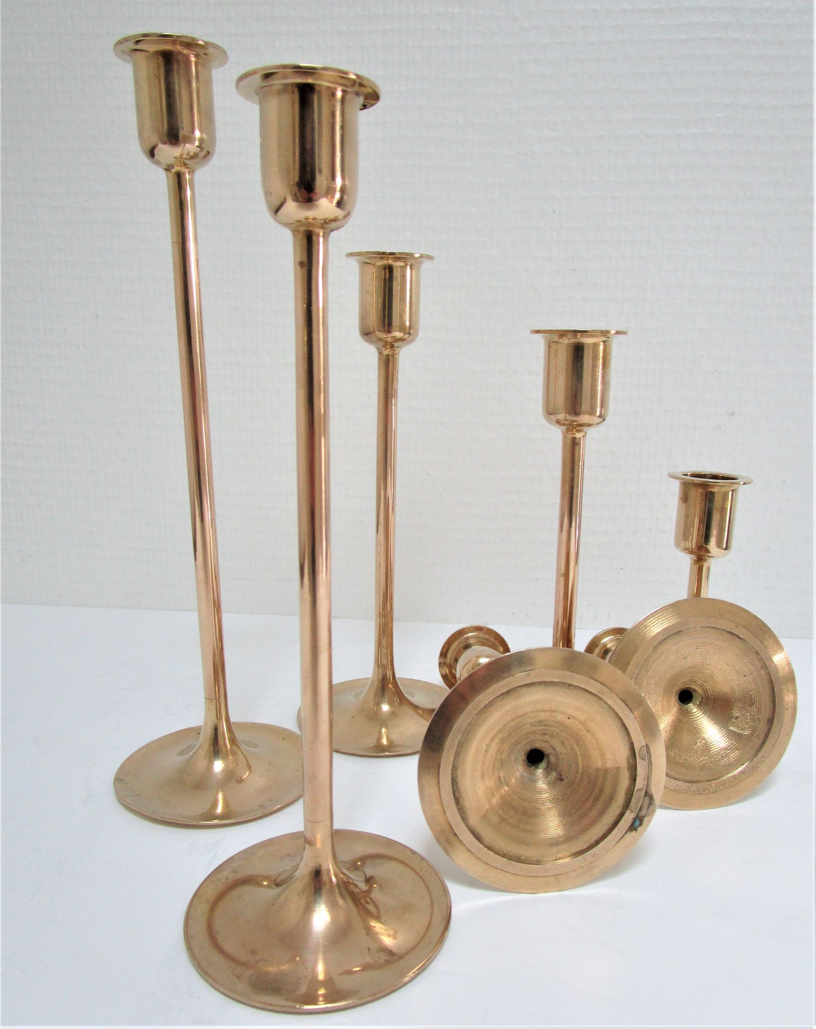 Series of seven candle holders solid brass
