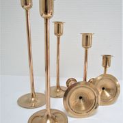 Series of seven candle holders solid brass