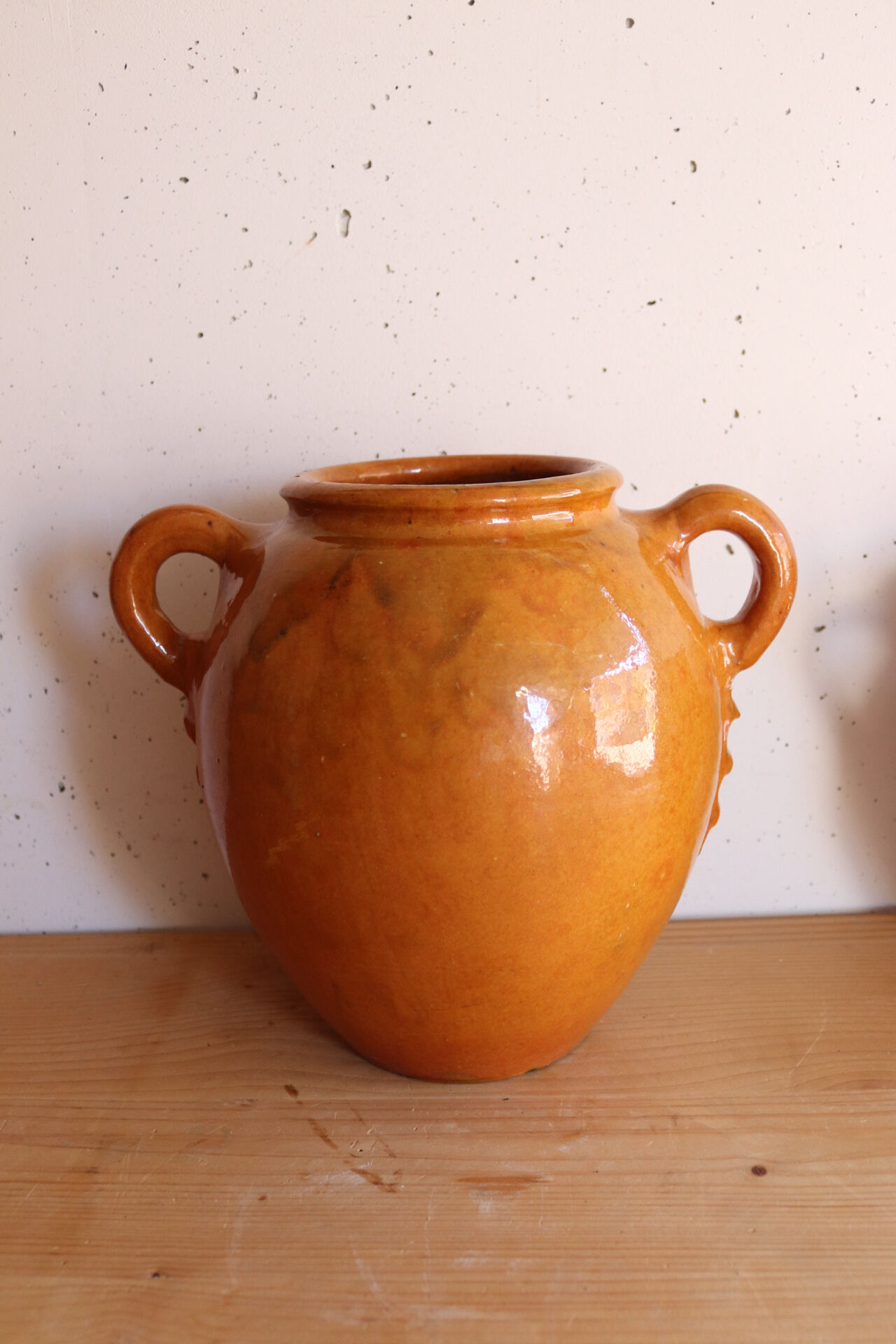 Old honey-glazed pot with two handles