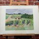 Framed watercolor depicting an agricultural landscape