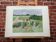 Framed watercolor depicting an agricultural landscape