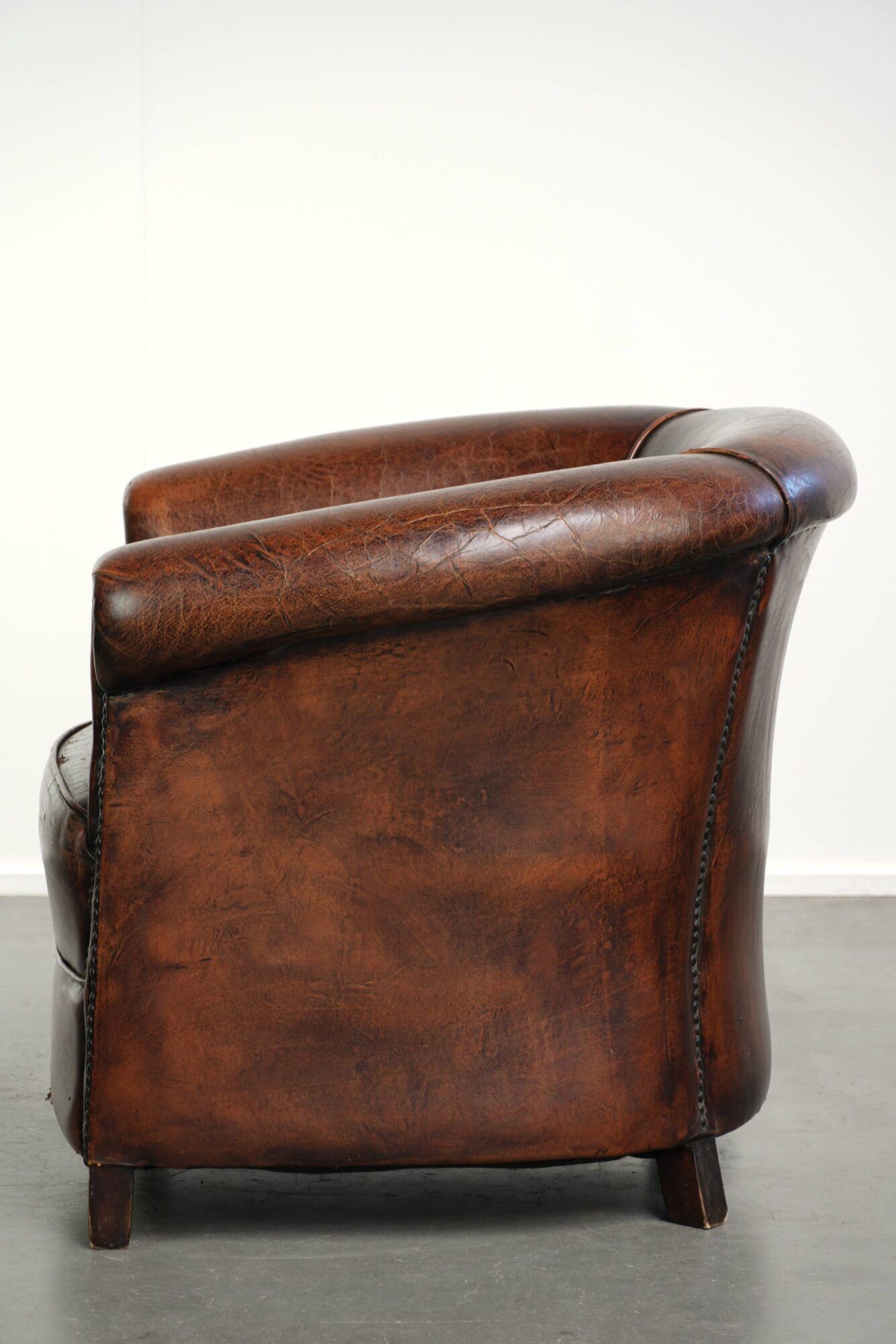Vintage sheepskin club armchair with beautiful colours and a subtle size