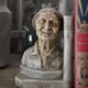 Book-clamps couple of realistic old men in plaster