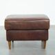 Sturdy vintage sheepskin ottoman in a beautiful large size with black piping