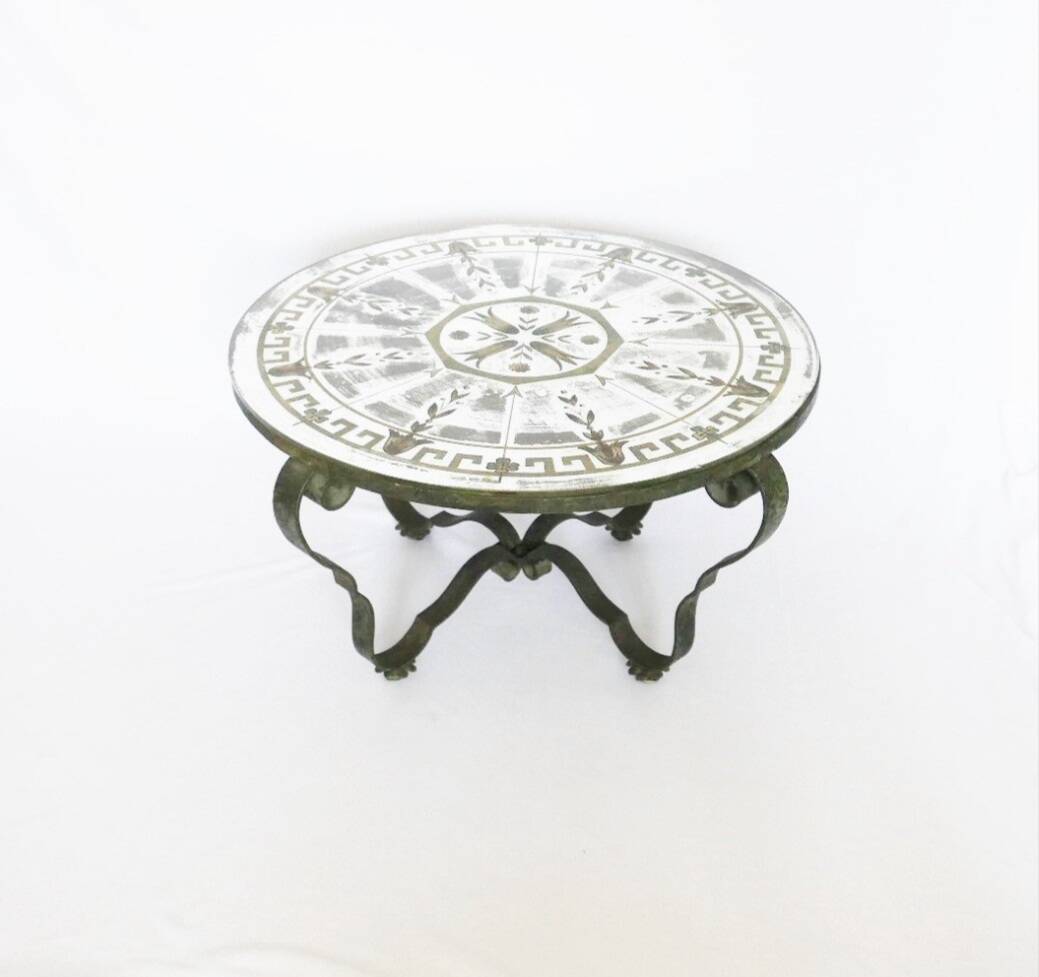Round table from the 1940s, wrought iron and eglomisé glass.