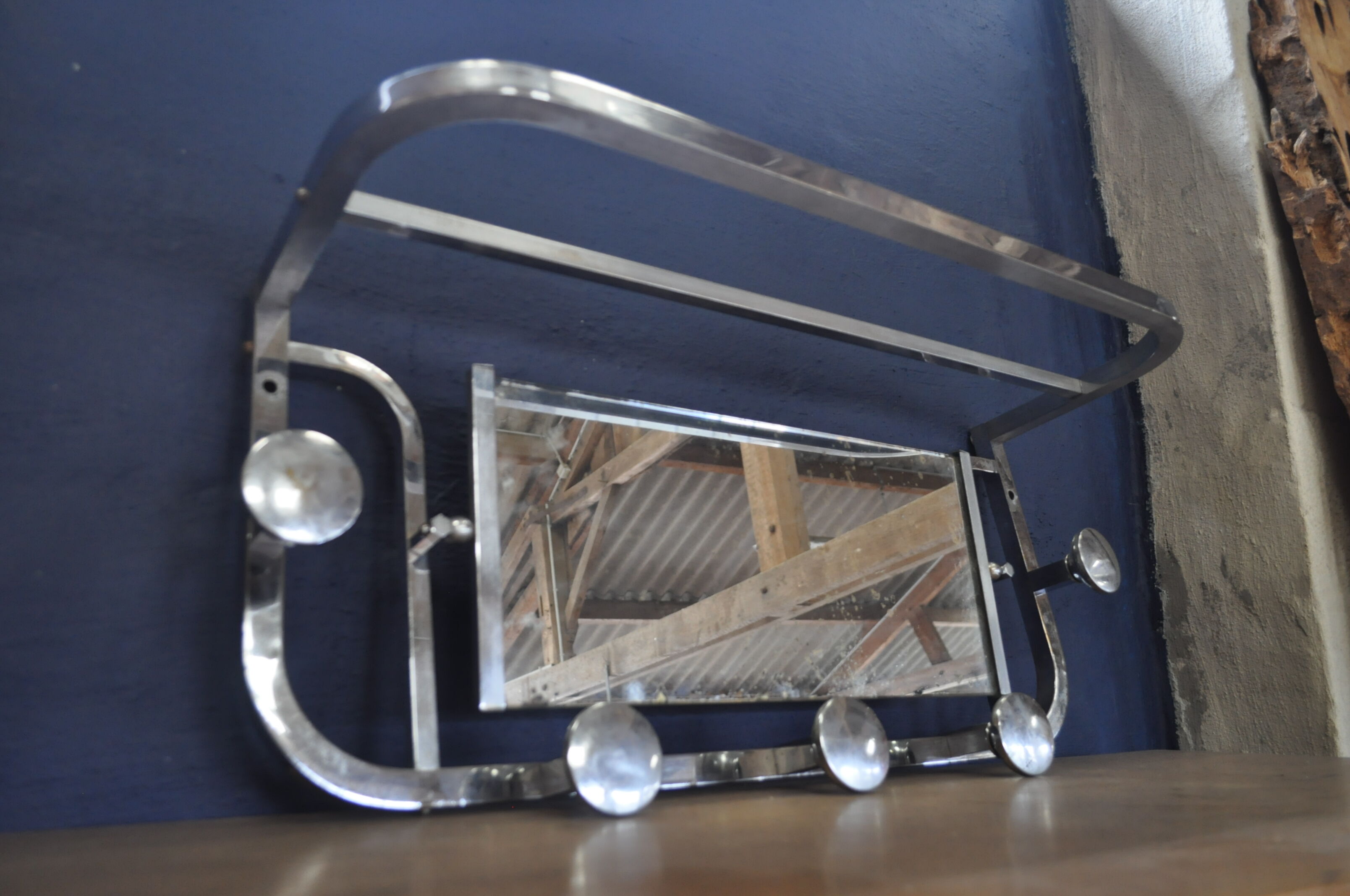 Aluminum wall coat rack.
