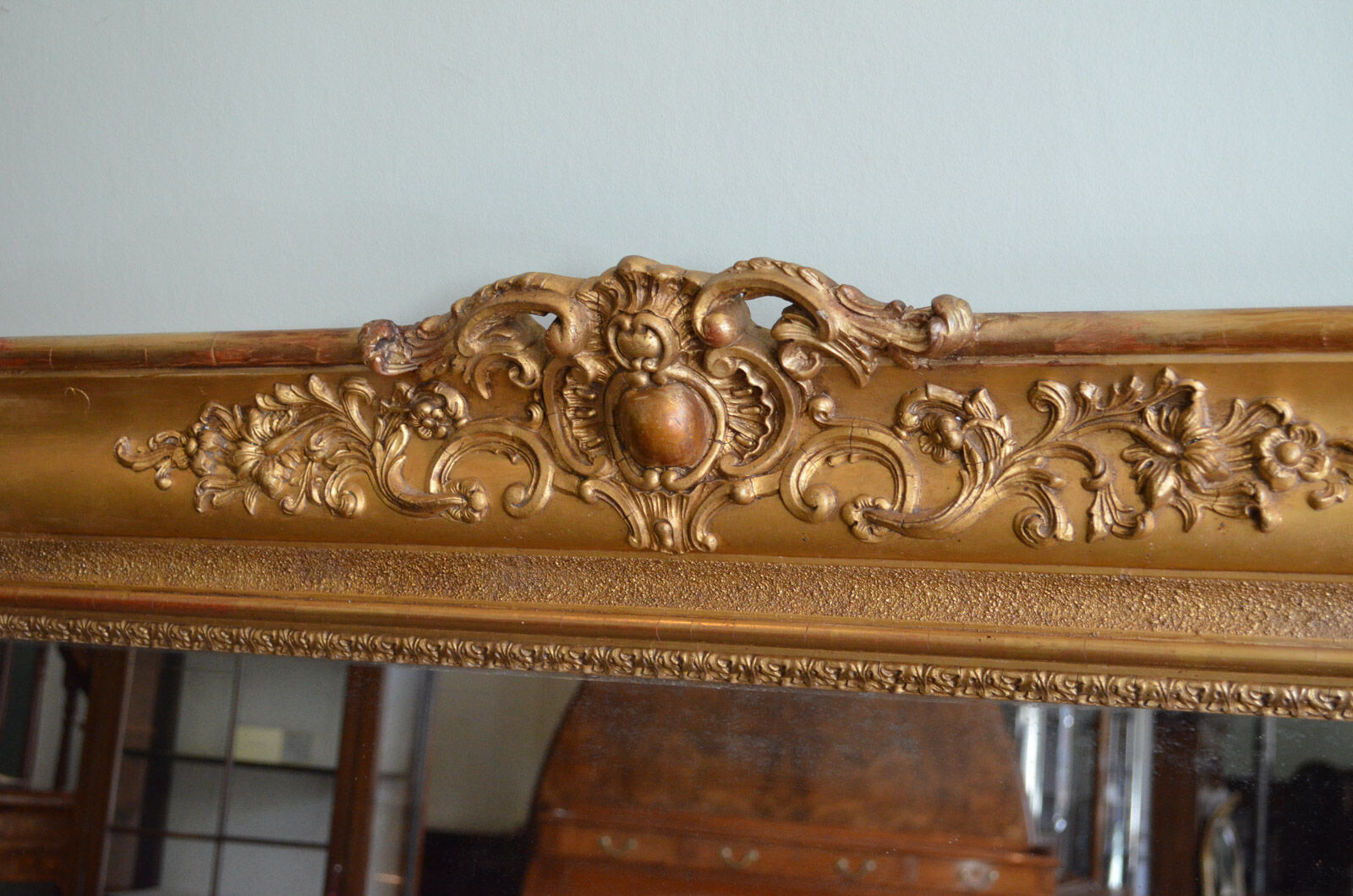 Nineteenth century monumental mirror in gilded wood