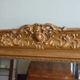 Nineteenth century monumental mirror in gilded wood